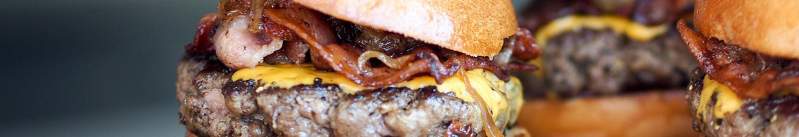 Eating Burger Sandwich at Tummy Stuffer Sandwiches restaurant in Chino, CA.
